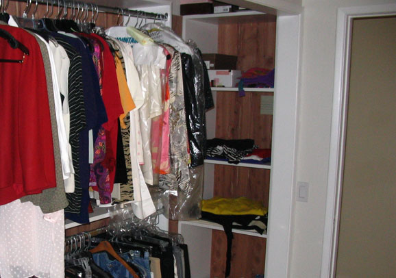 Spacious walk-in closet with shelves by Maurer Construction